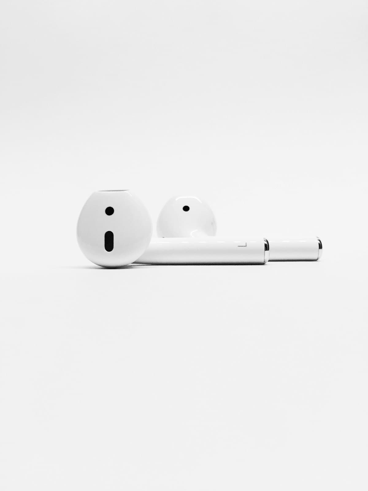 Apple AirPods on a dark background